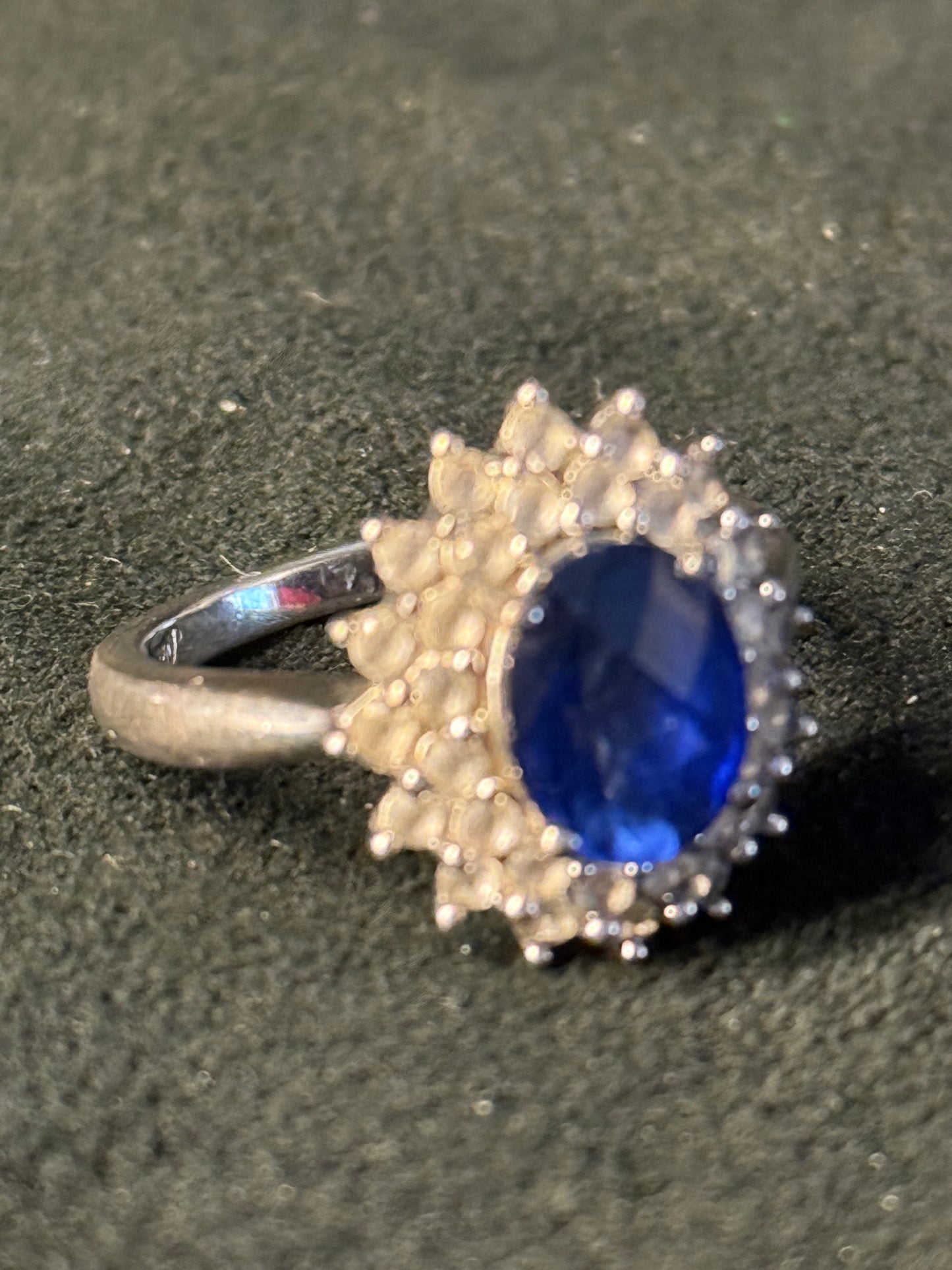 5.30 Carat Simulated Sapphire and 1.80 ct. t.w. CZ Ring in Sterling Silver.